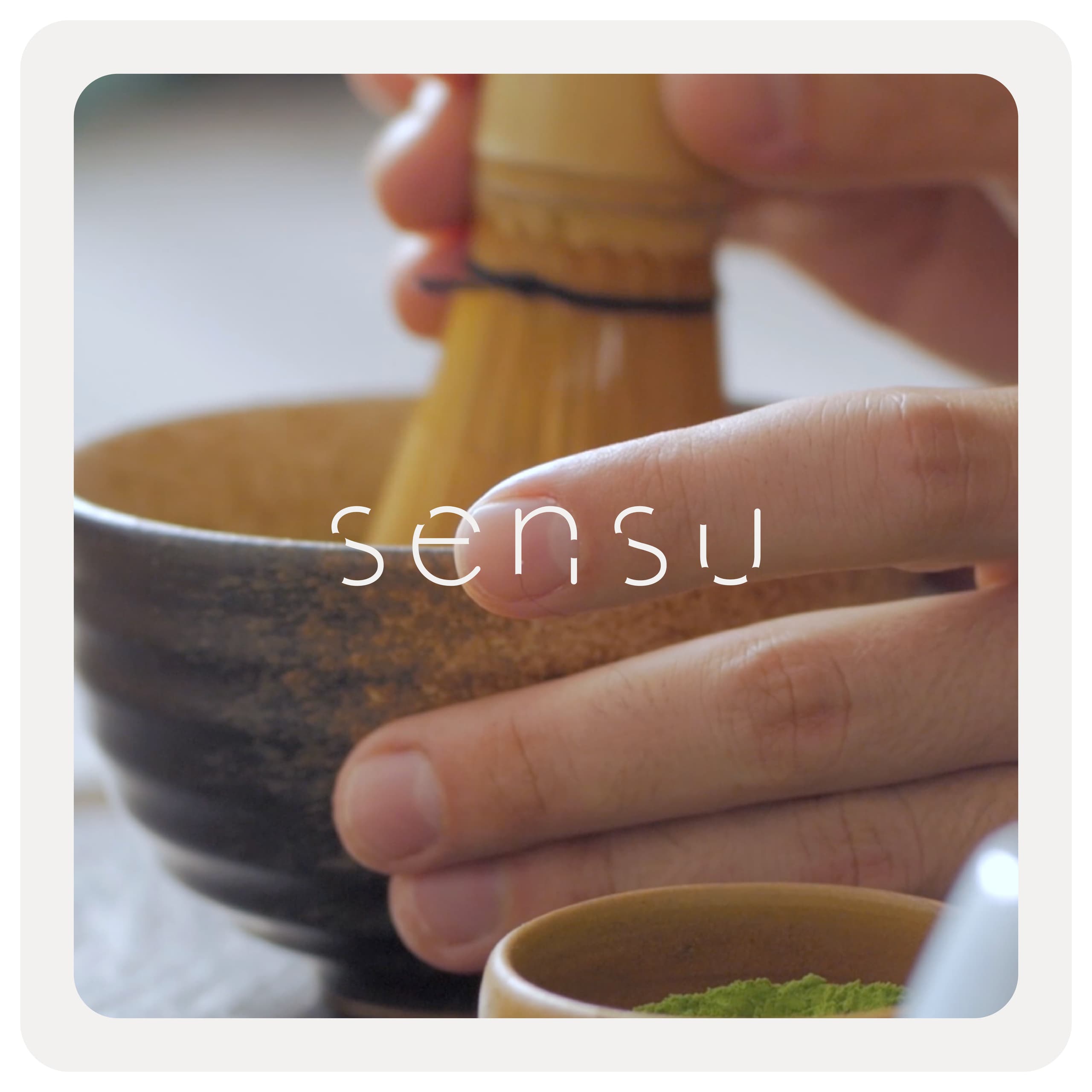 Matcha being whisked in a ceramic bowl